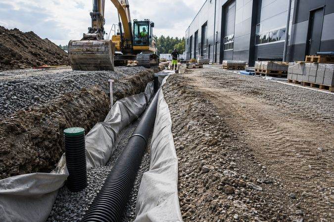 Erdarbeiten Drainage Baustelle